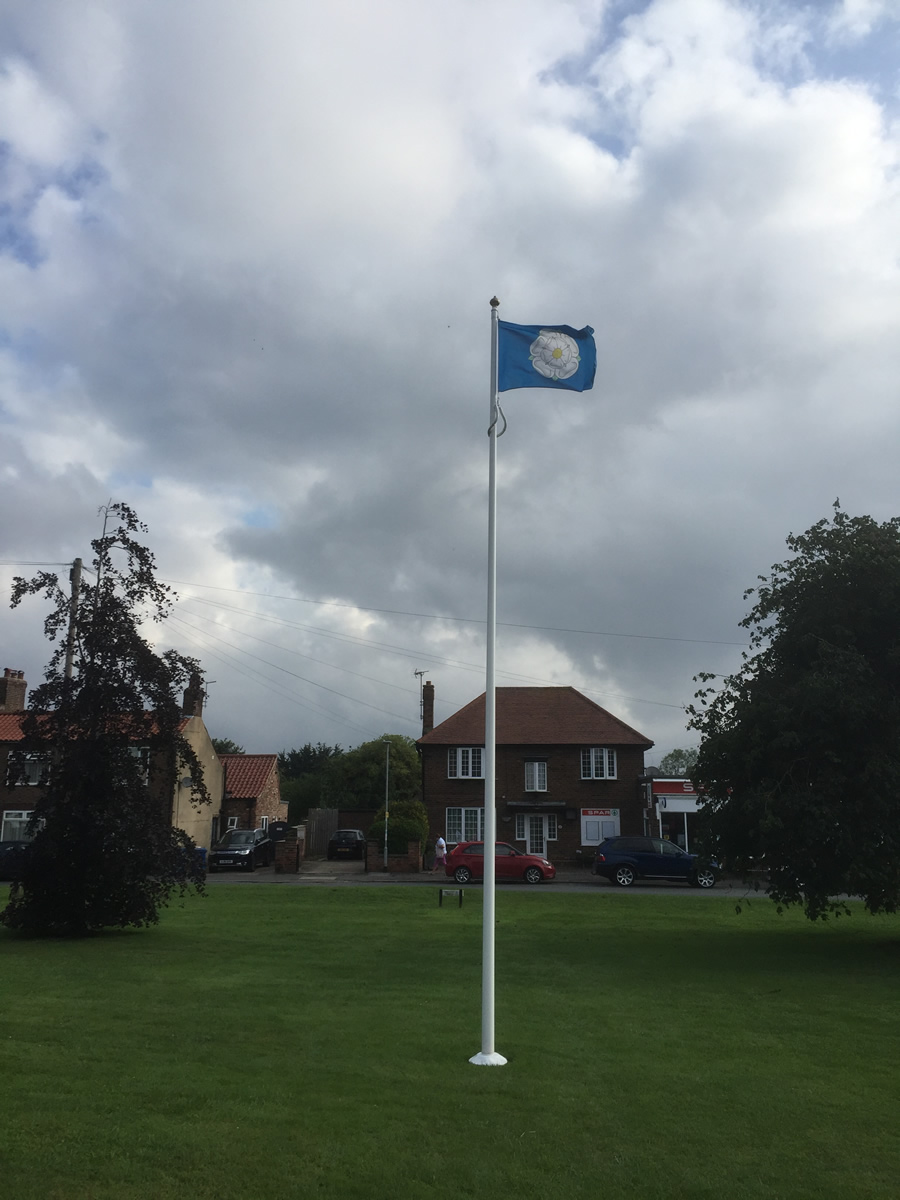 Flying the Yorkshire Flag on the village flag pole
